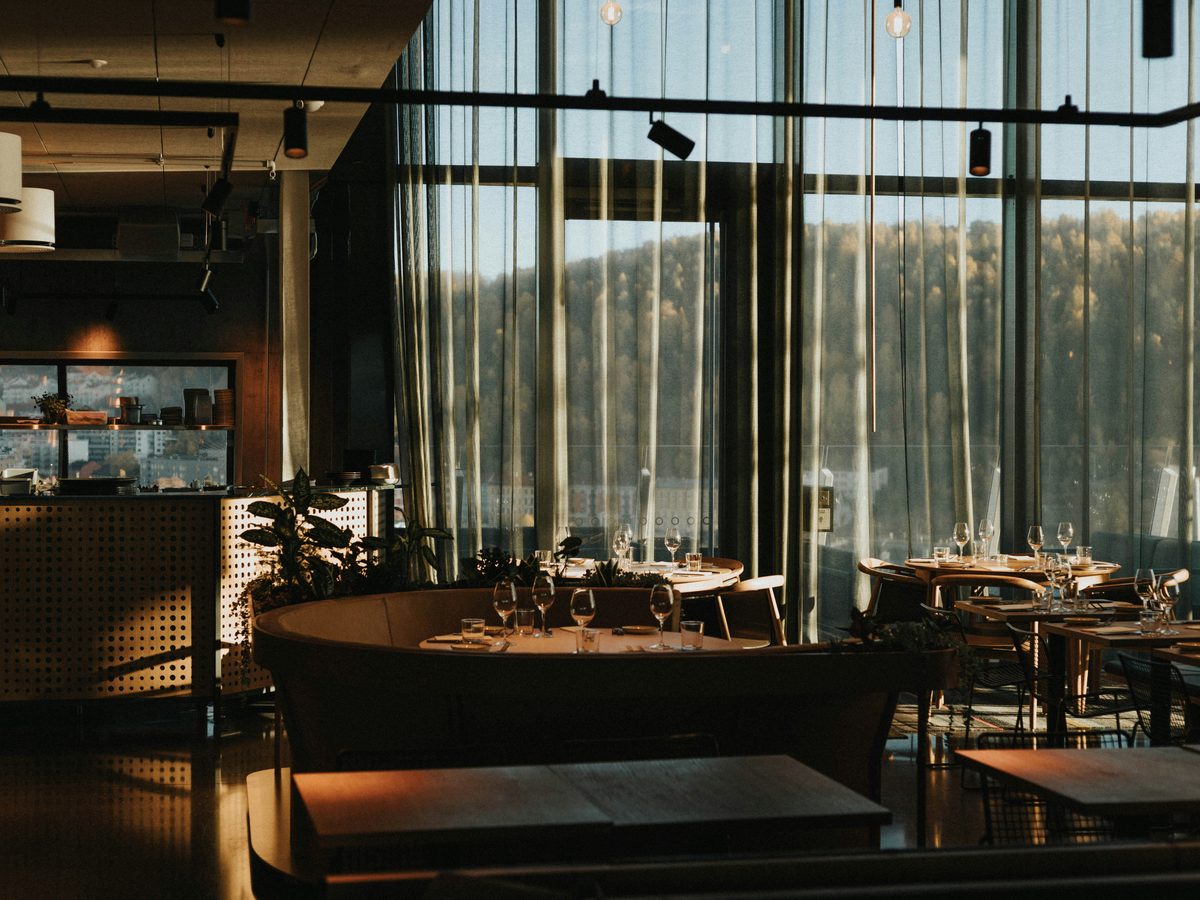 Sunlit restaurant interior with set tables